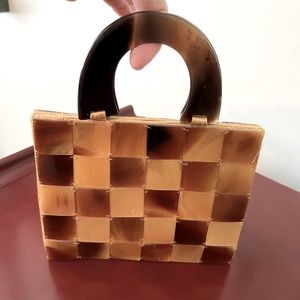 Tortoise Shell Tile bag with tortoise shell handle.